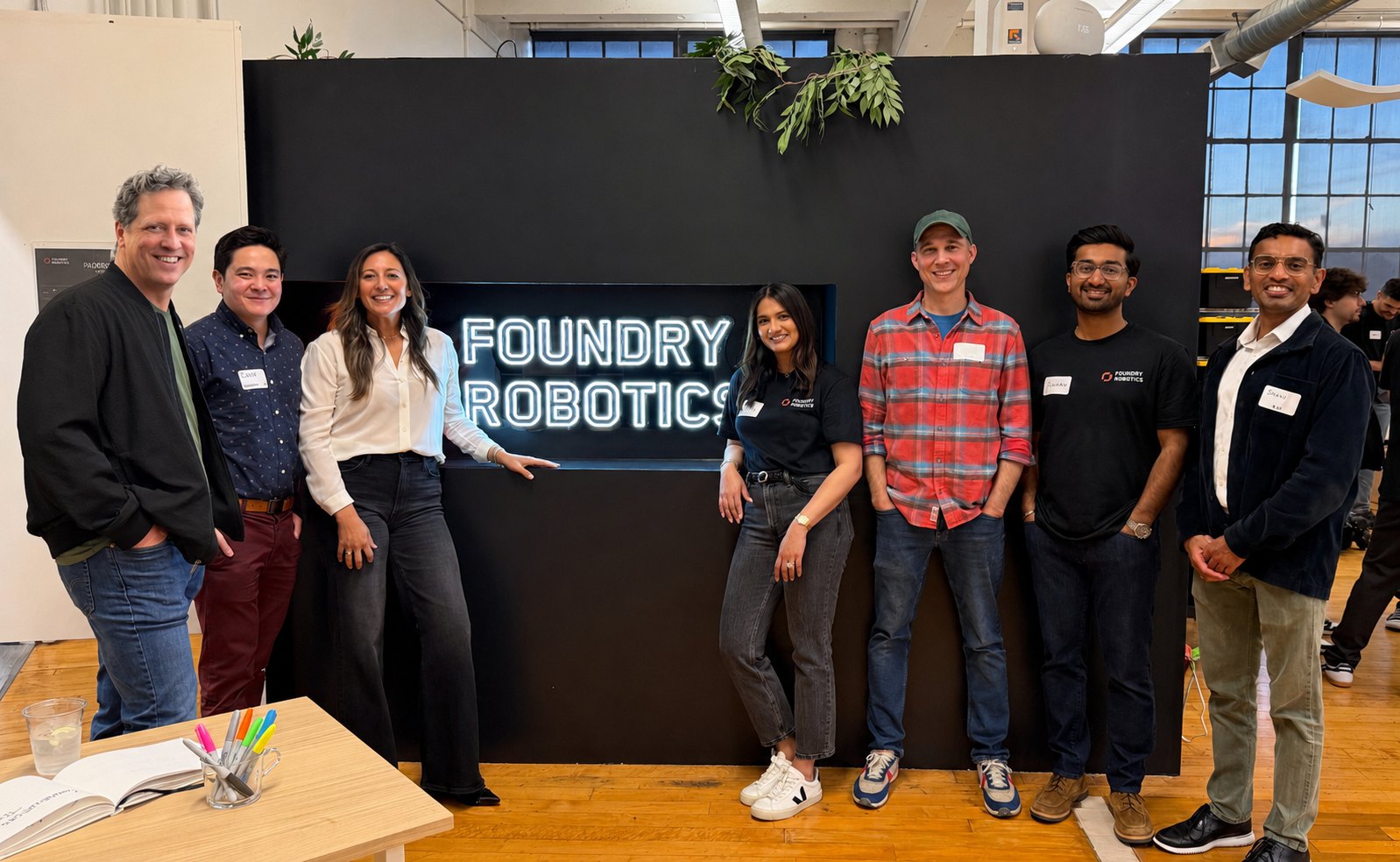The Zero Shot Fund team standing with the Foundry Robotics team in front of the Foundry Robotics sign.
